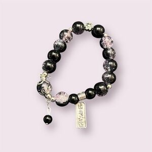 Black Beaded Bracelet has hints of purple